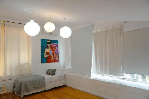a living room with a couch and a window at House Park Boutique - Casa de Huéspedes in Santa Fe