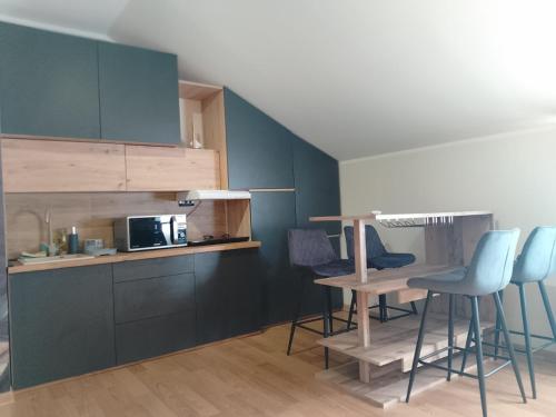 Η κουζίνα ή μικρή κουζίνα στο Apartman Happy 6