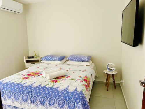 Un pat sau paturi într-o cameră la Casa de praia Búzios