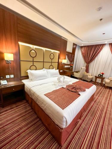فندق وست لاند West Land Hotelにあるベッド