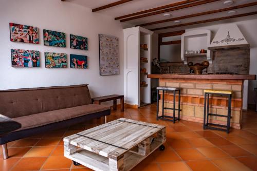 a living room with a couch and a fireplace at Casa Macondo Sachica-Villa de Leyva in Sáchica