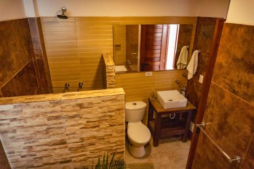 a bathroom with a toilet and a sink at Casa Macondo Sachica-Villa de Leyva in Sáchica