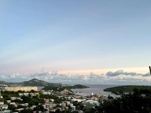 a view of a city and a body of water at Hibiscus a New Spacious Apartment with a Sea View and Perfect Location in Contant