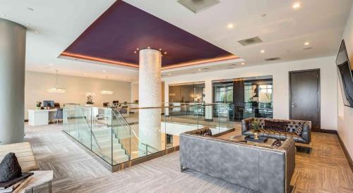 a large living room with a couch and a table at 2BR Uptown Charlotte Furnished Apartments apts in Charlotte