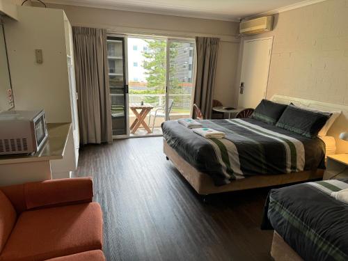 Postel nebo postele na pokoji v ubytování Ulladulla Harbour Motel