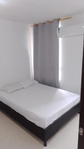 Katil atau katil-katil dalam bilik di Apartamento Valparaiso