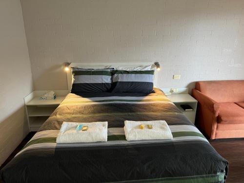 Postel nebo postele na pokoji v ubytování Ulladulla Harbour Motel