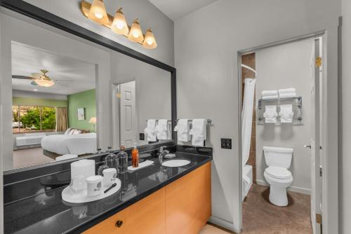 a bathroom with a sink and a toilet at Flanigan`s Resort and Spa in Springdale