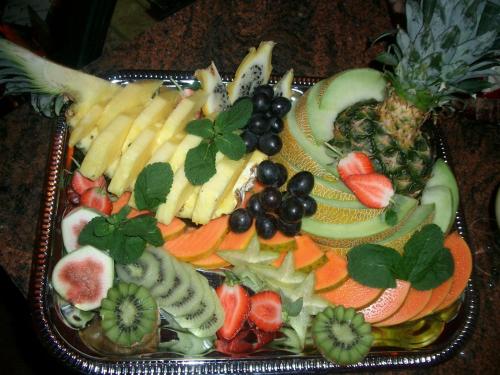 a tray of fruits and vegetables on a table at Gasthof Strausberg Nord in Strausberg