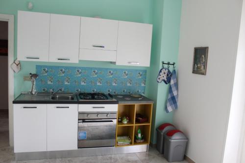 Kuchyň nebo kuchyňský kout v ubytování Stelle Sul Salento Holiday Home