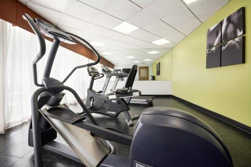 a gym with treadmills and ellipticals in a room at Country Inn & Suites by Radisson, Norcross, GA in Norcross