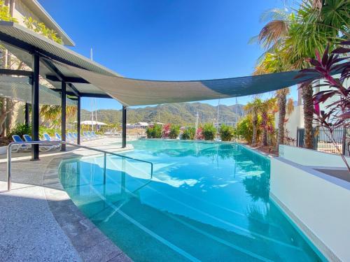 a swimming pool with a canopy in a house at Blue on Blue Studio Room 1222 in Nelly Bay