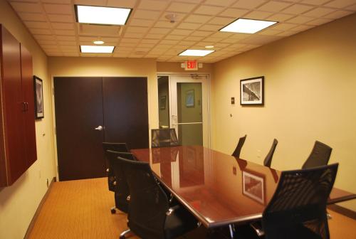 a conference room with a long table and chairs at Sleep Inn & Suites Clintwood in Clintwood