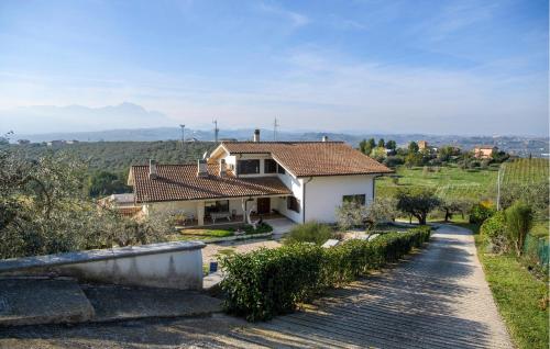 a house on a hill with a road at 2 Bedroom Cozy Apartment In Moscufo in Moscufo