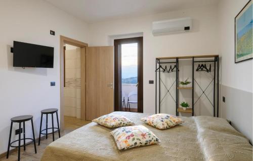 a bedroom with a bed with two pillows on it at Gorgeous Apartment In Moscufo With Wifi in Moscufo