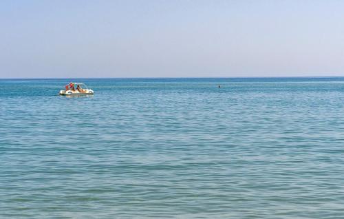 a boat in the middle of a large body of water at Amazing Apartment In Moscufo With Wifi in Moscufo