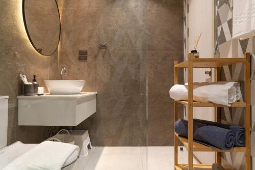 a bathroom with a sink and a shower at Title Halo Andaman Coast Pool View Gym in Nai Yang Beach