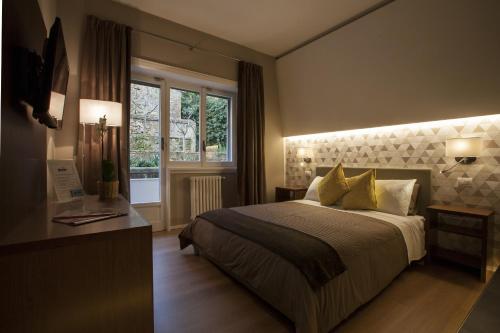 Säng eller sängar i ett rum på NG Guest House Roma San Pietro