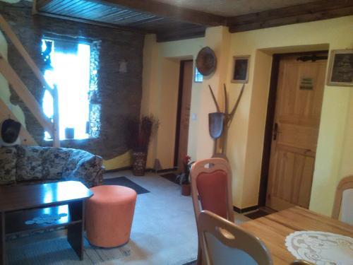 a living room with a couch and a table at Private Světluška in Poběžovice