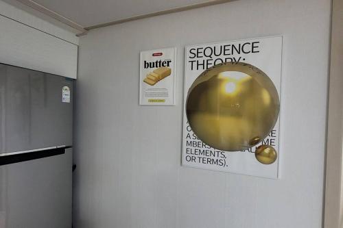 a wall with a science theory poster and a balloon at Incheon Sungeuidong happy stay for 10 pax in Incheon