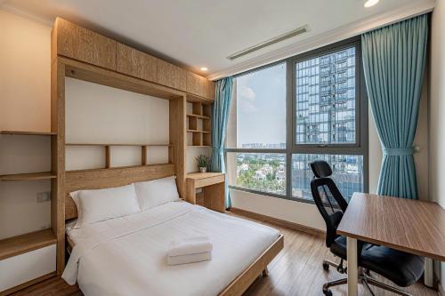 a bedroom with a bed and a desk and window at Vinhomes Landmark Luxury Apartment by Navie in Ho Chi Minh City