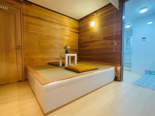 a sauna with a bench in a room with wooden walls at Lapis House 101 - 1F in Tokyo