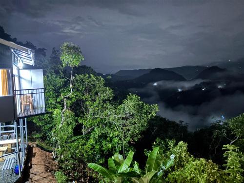 a view of the mountains from a house at Serenehills Retreat in Idukki