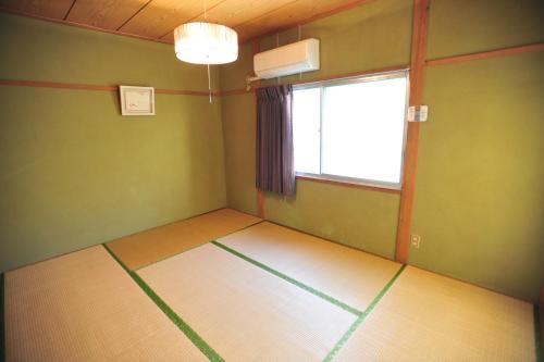 an empty room with a window at Nagasaki Kagamiya in Nagasaki