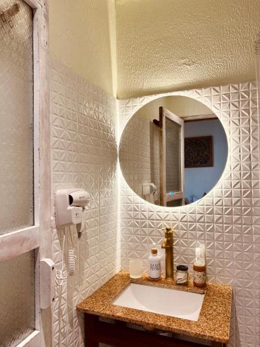 a bathroom with a sink and a mirror at New Yêu Biển homestay in Vĩnh Hy