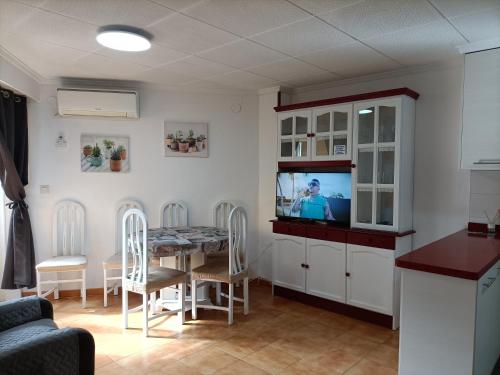 TV a/nebo společenská místnost v ubytování Apto Palacios con Piscina y Parking