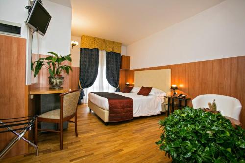 מיטה או מיטות בחדר ב-Hotel Parco Dei Principi