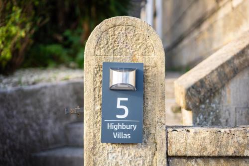 a stone post with a lightheartedly wishes sign on it at Haven in Bath
