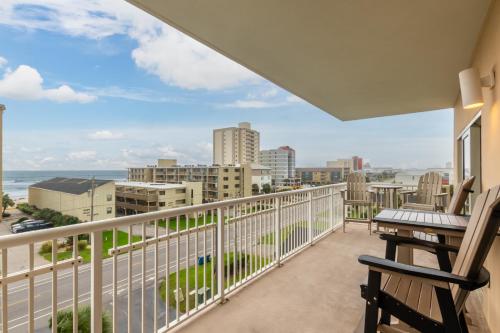 a balcony with a view of the ocean and buildings at Crystal Tower Condos in Gulf Shores
