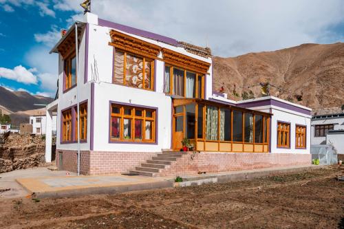 a house in front of a mountain at Sakti Eco Homestay in Chimre