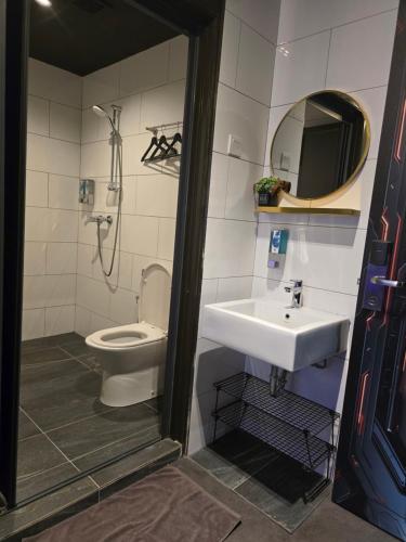 a bathroom with a sink and a toilet at Space Hotel KL Sentral in Kuala Lumpur