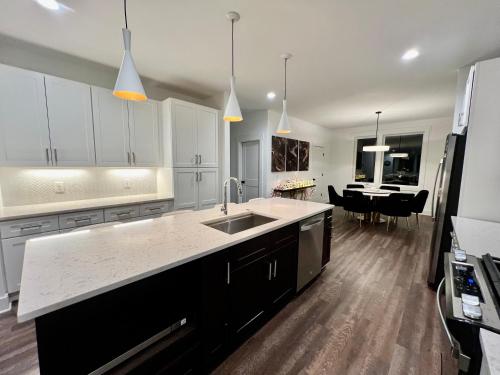 a kitchen with a sink and a counter top at New Elevations Rooftop 5 Min to Downtown Nash in Nashville