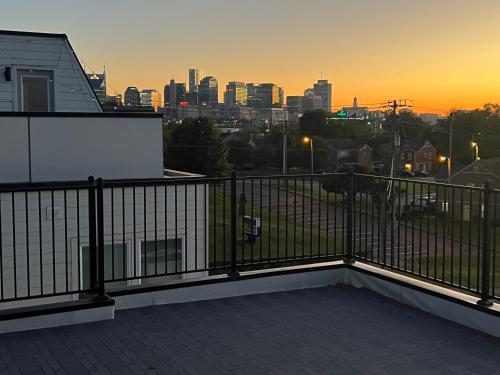 a balcony of a house with a view of a city at New Elevations Rooftop 5 Min to Downtown Nash in Nashville