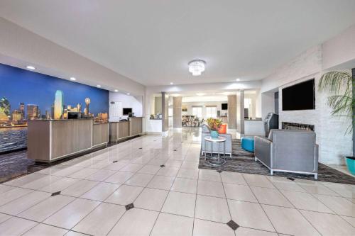 a hospital lobby with a view of the city at La Quinta by Wyndham Alvarado in Alvarado