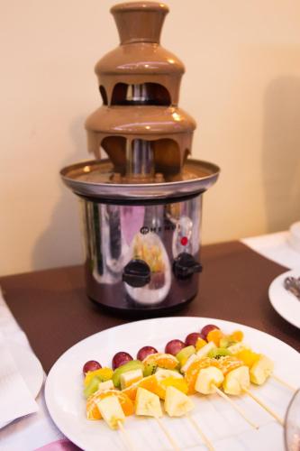 a plate of food on a table with a food processor at Anthimos in Baile Felix