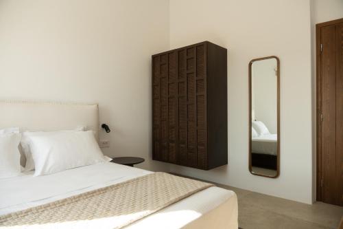 Ένα ή περισσότερα κρεβάτια σε δωμάτιο στο Kavos Villas Skyros