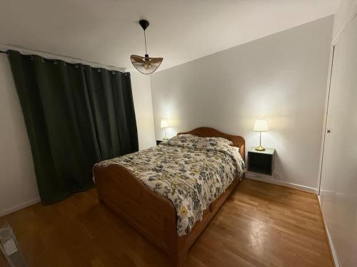 Ένα ή περισσότερα κρεβάτια σε δωμάτιο στο Appartement spacieux