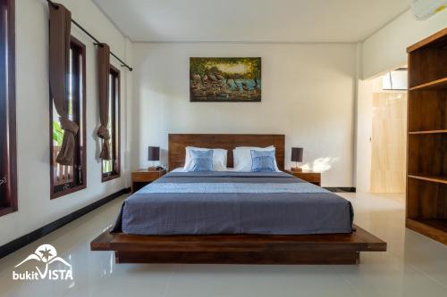 En eller flere senge i et værelse på Kubu BK by Bukit Vista