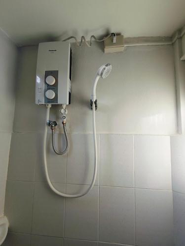 a shower in a bathroom with a showerigunigun at Bogah Lodge in Banaue