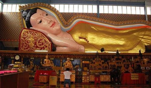 a large painting of a woman on the wall of a store at Dou Houz Georgetown in George Town