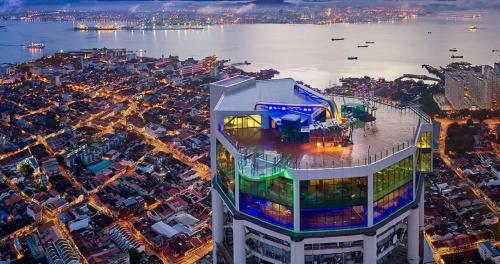 an overhead view of a building with a city at night at Dou Houz Georgetown in George Town
