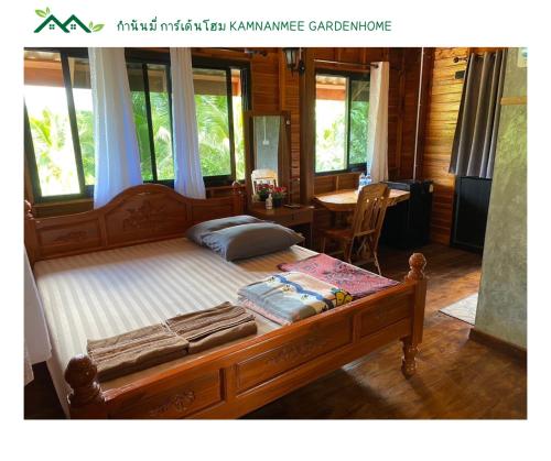 Postel nebo postele na pokoji v ubytování กำนันมี่การ์เด้นโฮม Kamnanmee Gardenhome