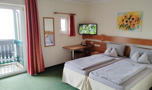 Postel nebo postele na pokoji v ubytování Hotel Fortuna