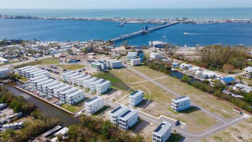 an aerial view of a city with a harbor at Baydream Believer at Hunter's Point in Cortez