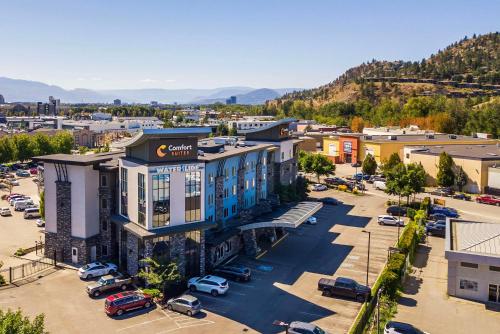 an aerial view of a town with a parking lot at Comfort Suites Kelowna in Kelowna
