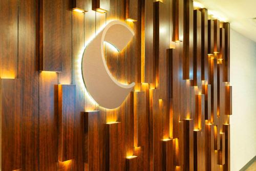 a sign on a wall with lights on it at Comfort Suites Kelowna in Kelowna